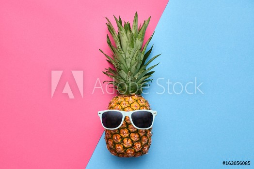 Picture of Pineapple Fruit Hipster Bright Summer Color Accessories Tropical pineapple with Sunglasses Creative Art concept Minimal style Summer party background